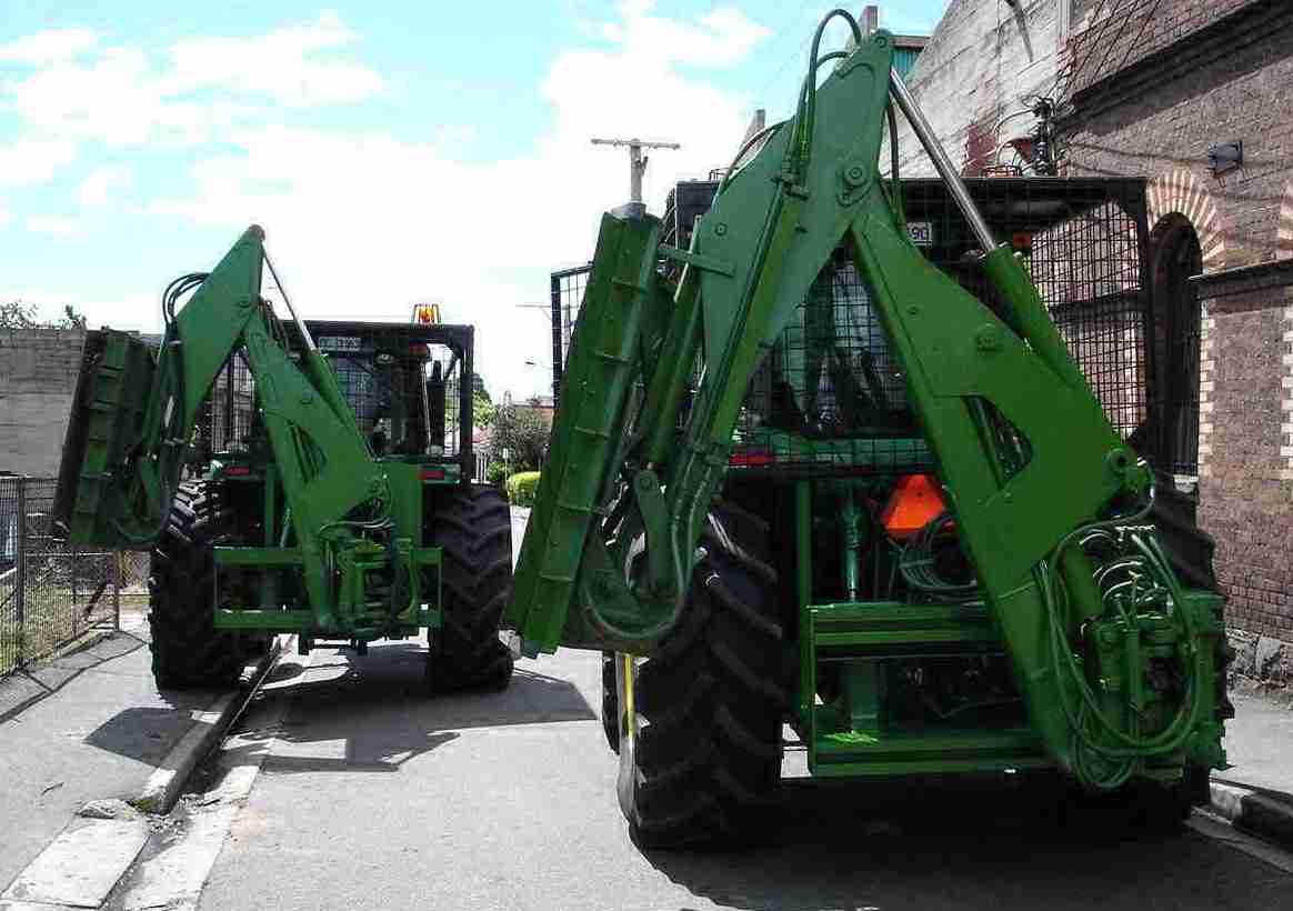 Photo of our John Deere tractors with arms attached